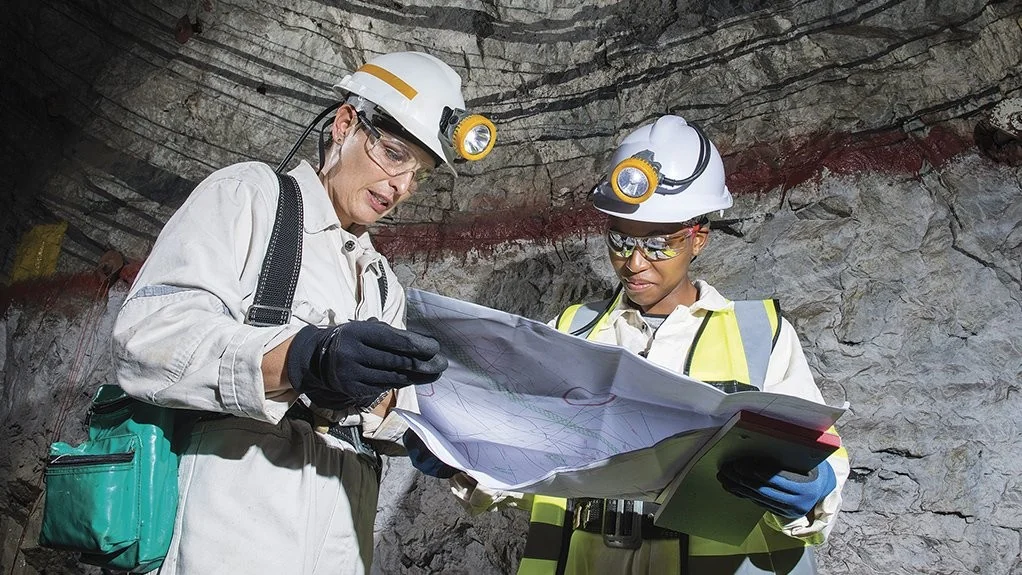 Underground team reviewing mine plans